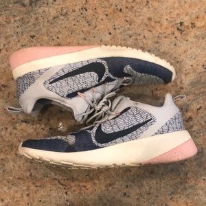Women’s pink and blue Nike sneakers